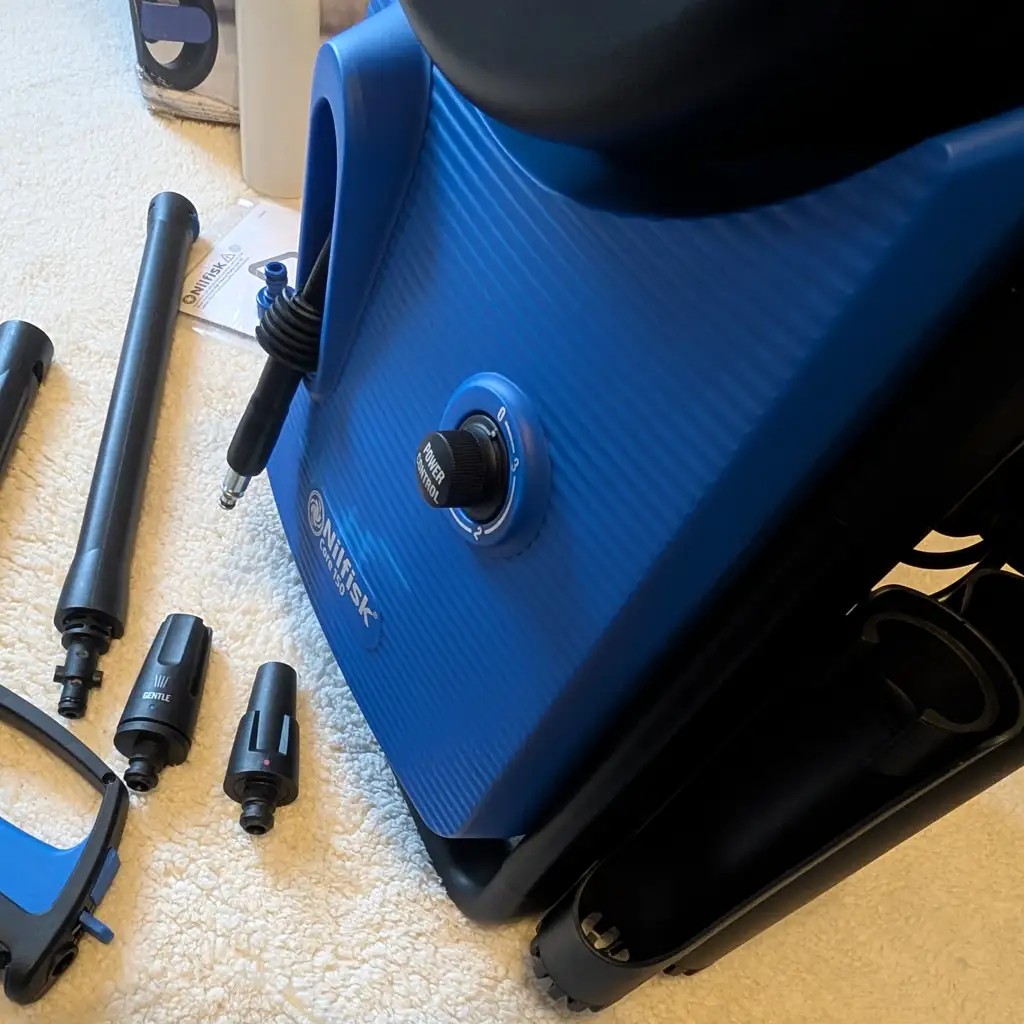 Nilfisk Core 150 pressure washer front view showing control dial and branding