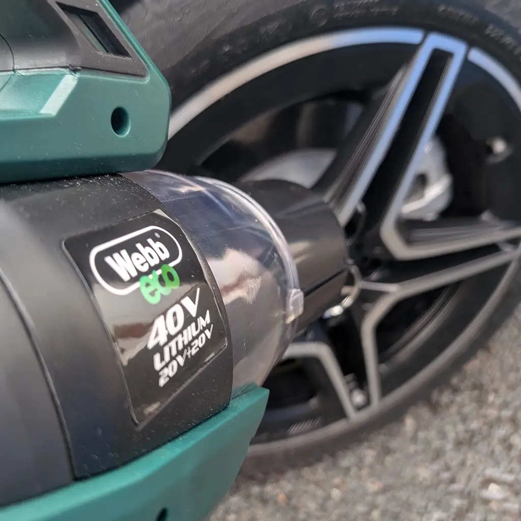 Text: Webb cordless blower drying alloy wheels after washing