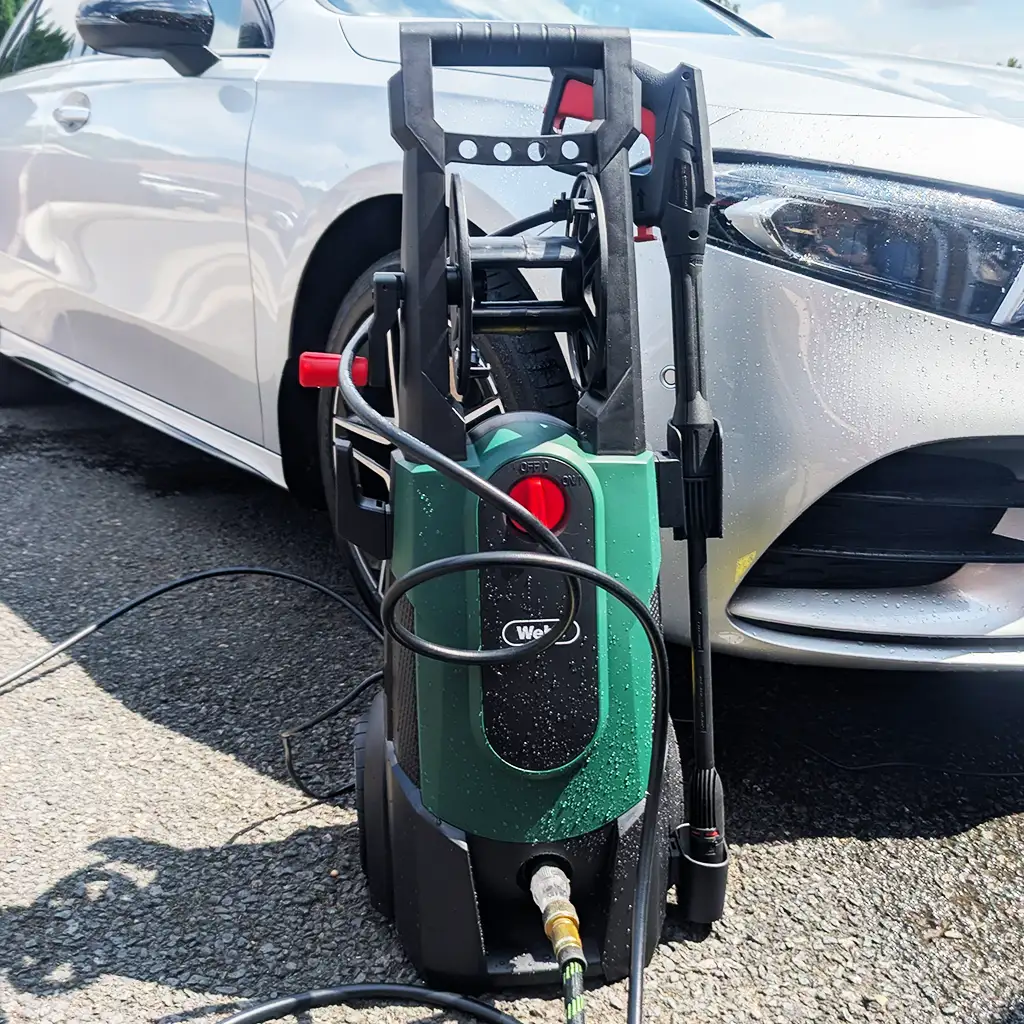 Webb WEPW2200 pressure washer rinsing a car bonnet using fan jet spray
