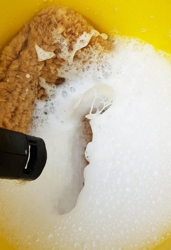 car shampoo foaming in bucket